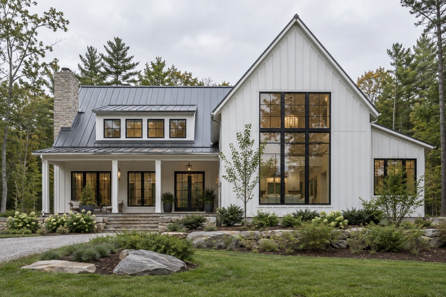Modern farmhouse with standing-seam roof and black windows